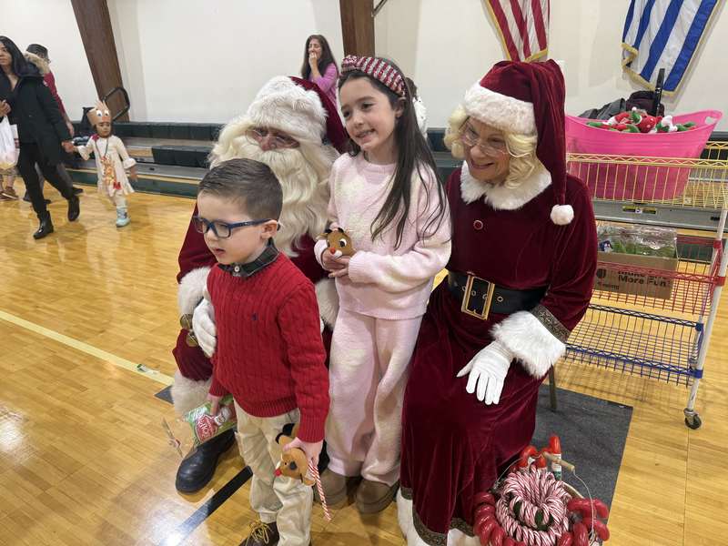 Families gathered in the gym for a holiday celebration