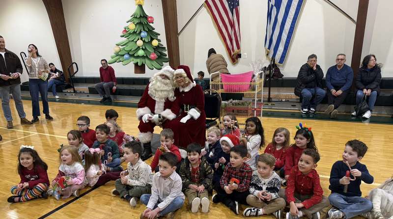 Children visiting with Santa at a holiday gathering