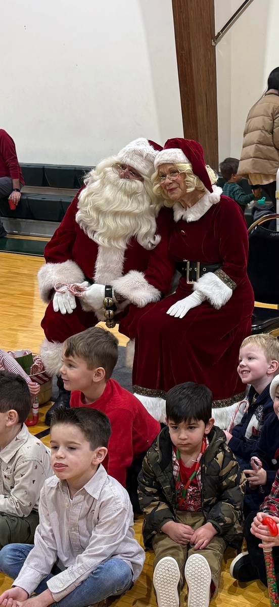 Children visiting with Santa and Mrs. Claus at the Humpty Dumpty Holiday Show and Party