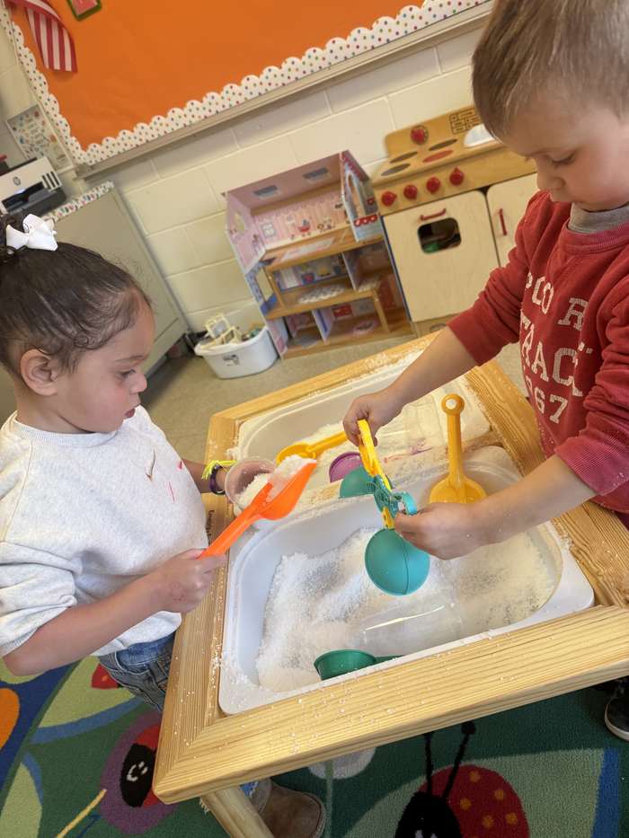 A close-up of a child's hands during sensory play