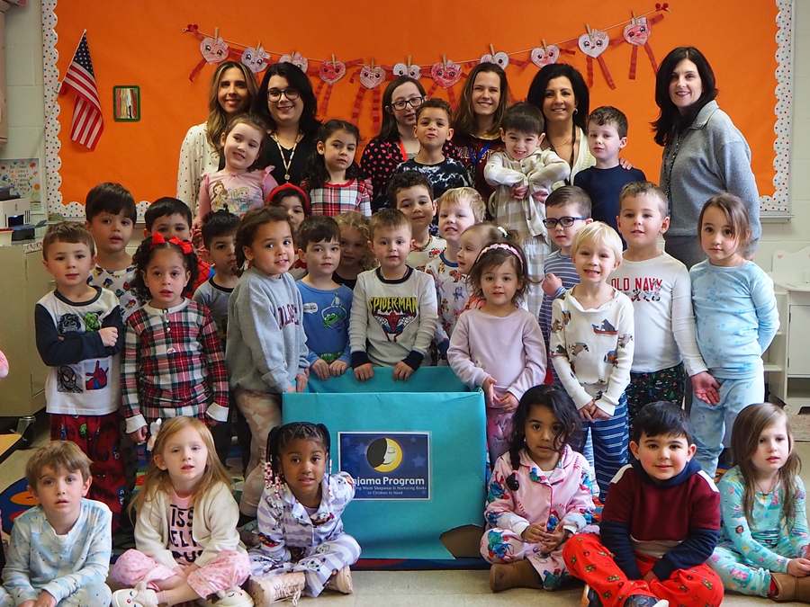 Humpty Dumpty teachers and staff with their class during the annual Pajama Program collection